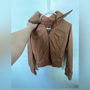 Chestnut leather jacket with fur on the inside
